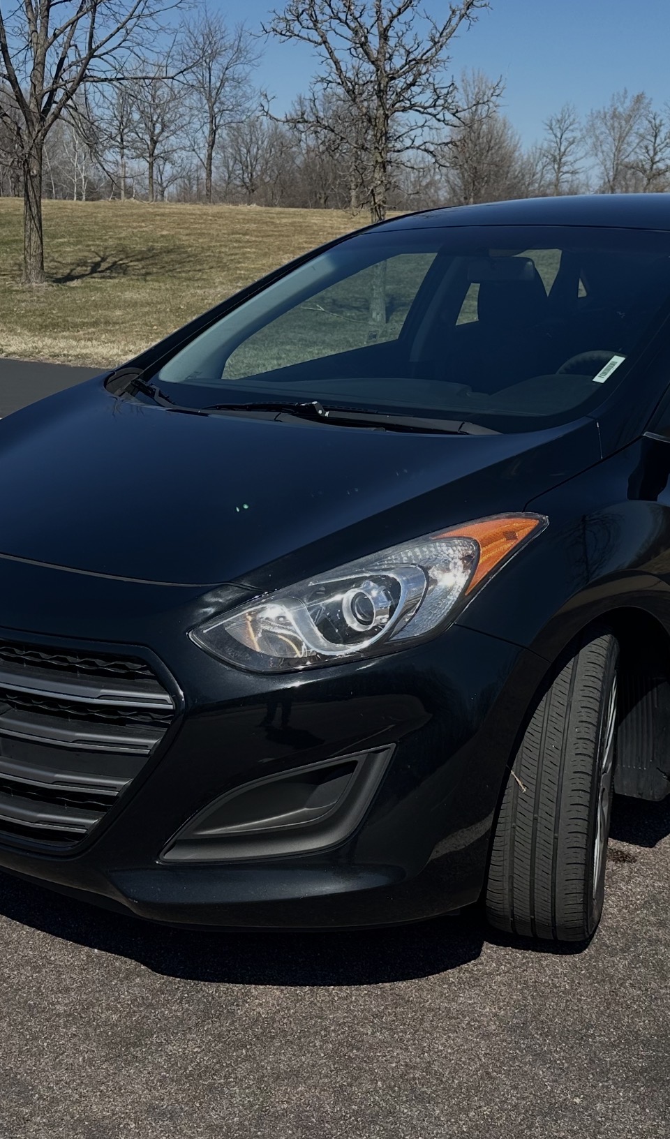 Restored clear headlight on a black Hyundai